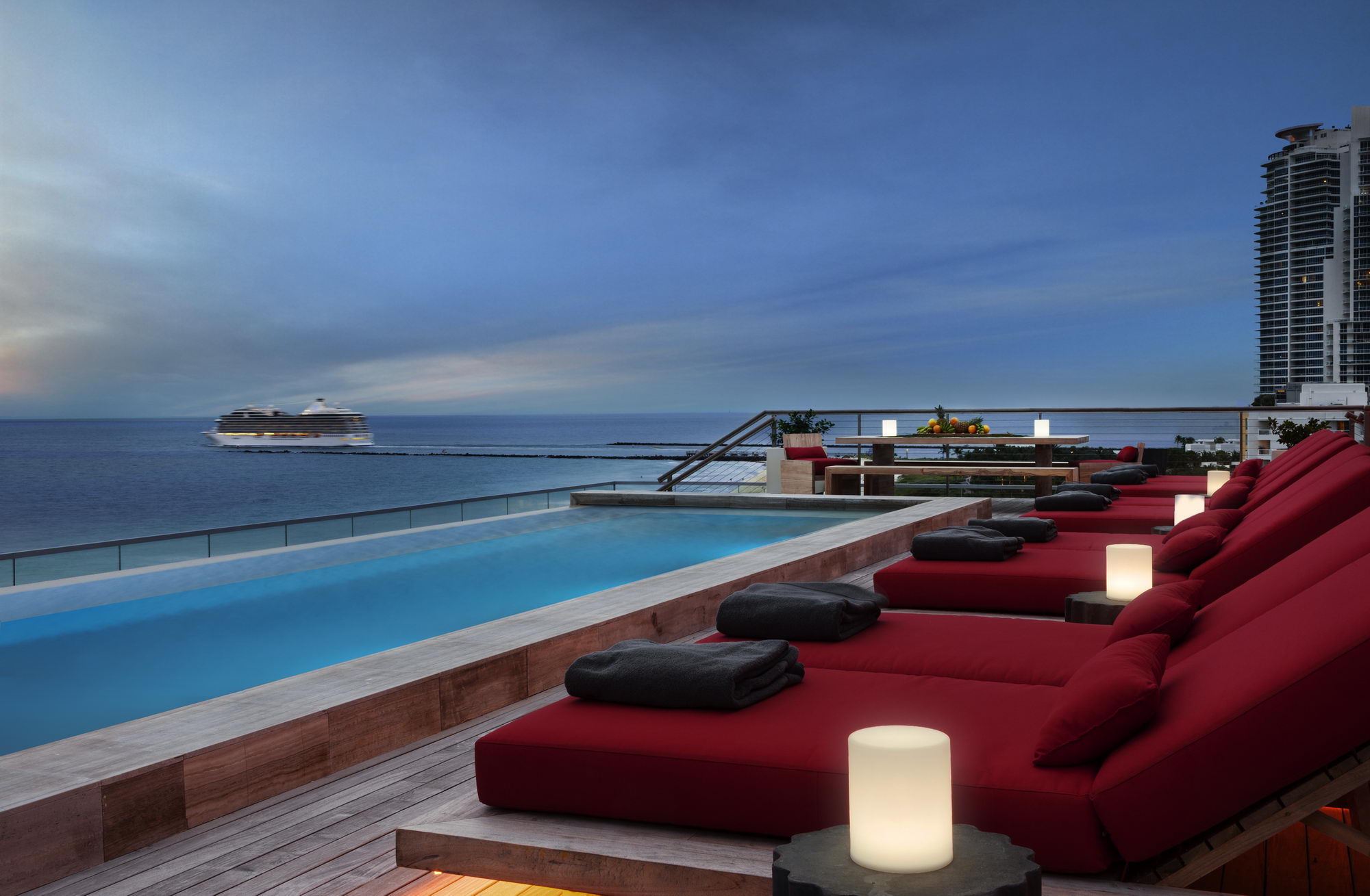 Ocean penthouse beach view south beach Miami Florida contemporary apartment exterior terrace deck infinity pool ocean view cruise lounge chairs