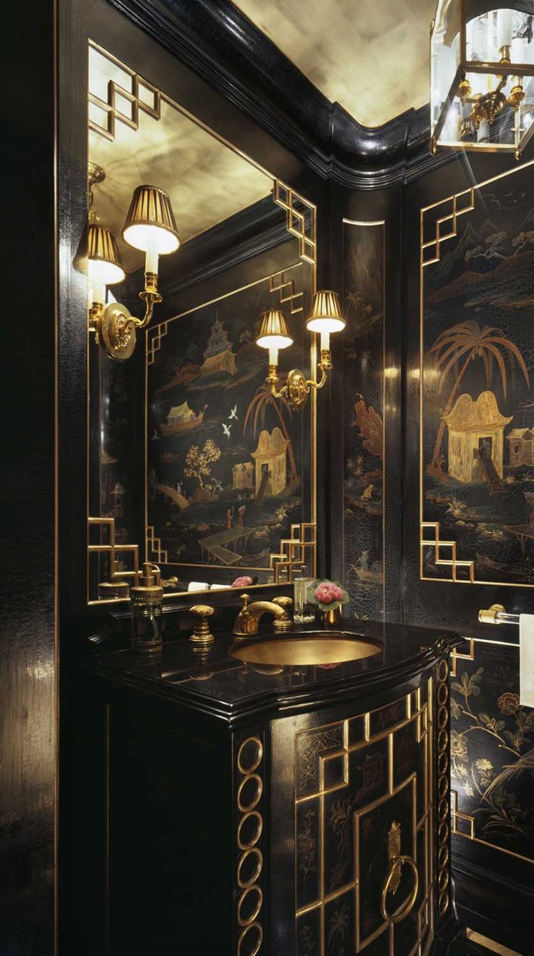 Powder room with black lacquer chinoiserie wallcovering, brass sconces, gold-trim mirror, lantern, and decorative vanity.